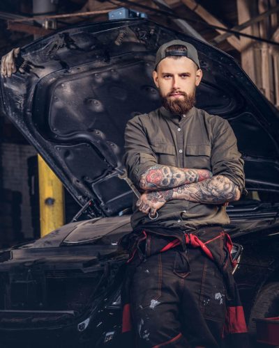 two-bearded-auto-mechanic-working-in-repair-garage-2025-01-26-10-54-43-utc.jpg